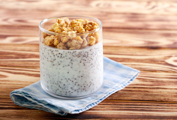 Chia seed with yogurt and granola topping snack in a glass