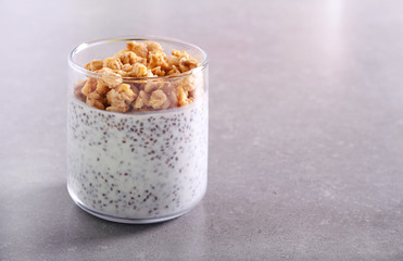 Chia seed with yogurt and granola topping snack in a glass