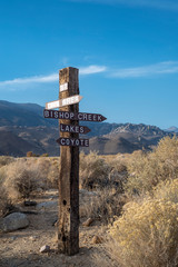 wooden signpost arrows with hand-painting lettering recreation areas Eastern Sierra Nevada mountains, California, USA