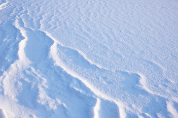 Detail of snow drift lit by low angle winter sun