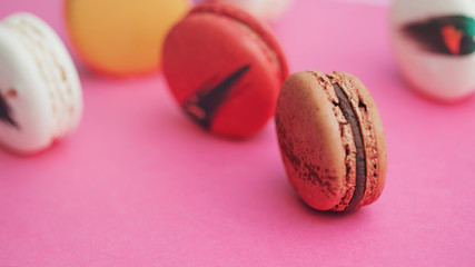 Elegant French desserts. Set of colorful macaron decorated by confectionery colours and toppings.