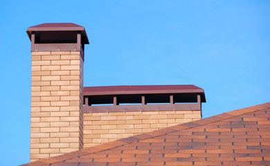 brick smokestack on background sky
