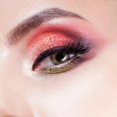 Amazing Bright eye makeup in luxurious scarlet shades. Pink and blue color, colored eyeshadow