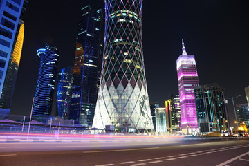 Fototapeta na wymiar Night road traffic in financial centre in Doha, Qatar