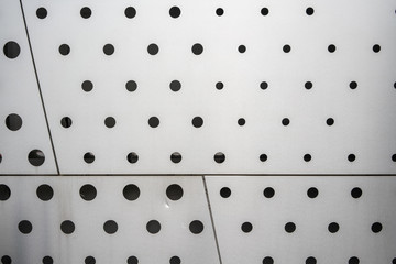 Black polka dot pattern on white background texture
