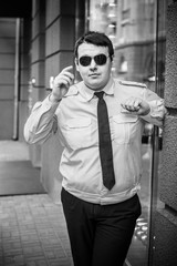 Young plus size man in uniform in city streets, plump people concept, one in big city life