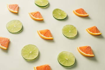 Composition with slices of citrus on color background