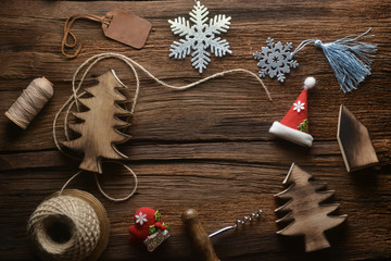 Christmas composition. Christmas gifts, pine tree, toys on Wood background. Flat lay, top view.
