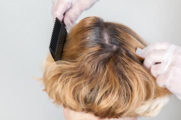 Dark roots of hair, overgrown hair