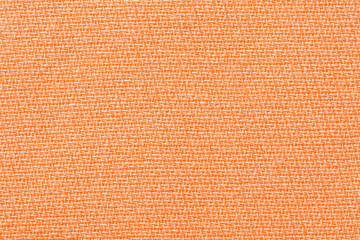 Orang fabric background texture. Detail of textile material close-up
