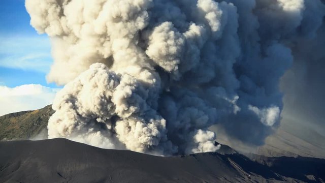 Time lapse active volcano Mt Bromo erupting smoke Java Indonesia South East Asia