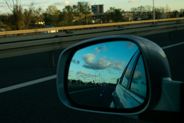 Fototapeta na wymiar road in the rearview mirror