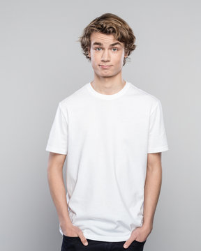 Portrait of cute young man in white t-shirt