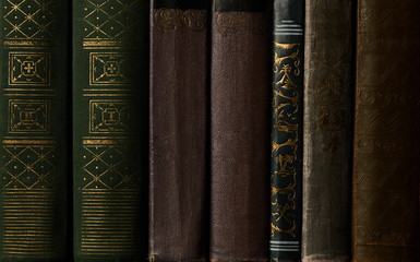 Old books on a bookshelf as abstract background. Vintage books