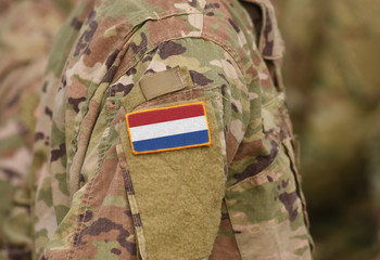 Flag of Netherlands on soldiers arm (collage).