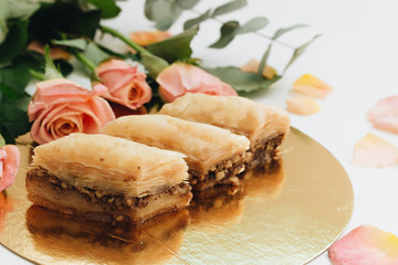 Baklava sweet dessert. Pastry made of layers of filo filled with chopped nuts and sweetened and held together with syrup or honey