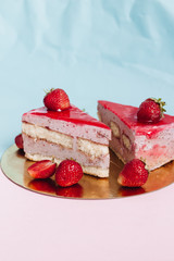 Piece of delicious strawberry cake with monstera leaf 