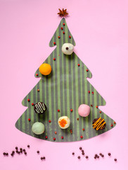 Festive background from color paper and tasty truffles.