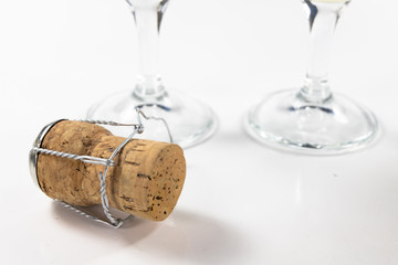 Cork from champagne on a kitchen table. Good New Year's drinks and great fun.