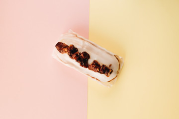 Delicious eclair with white glaze, sweet dessert