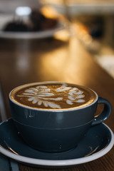 Cup of coffee with latte art, morning drink