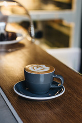 Cup of coffee with latte art, morning drink