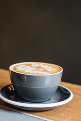 Cup of coffee with latte art, morning drink