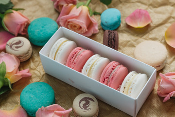 Composition of delicious macaroons in gift box, sweet dessert