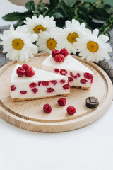 Two pieces of delicious cake with raspberries, sweet dessert