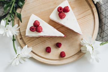 Two pieces of delicious cake with raspberries, sweet dessert