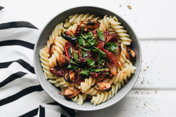 Delicious pasta with tomatoes, mussels and herbs