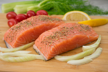 Salmon and Vegetables on a Cutting Board