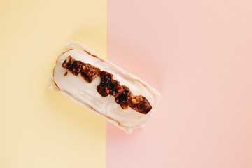 Delicious eclair with white glaze, sweet dessert