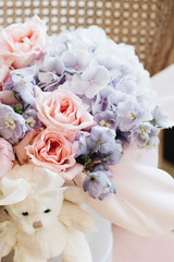 Fototapeta na wymiar Beautiful spring bouquet with tender pink and blue hydrangea flowers