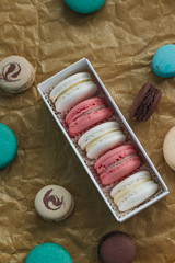 Composition of delicious macaroons in gift box, sweet dessert