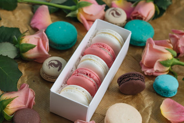 Composition of delicious macaroons in gift box, sweet dessert
