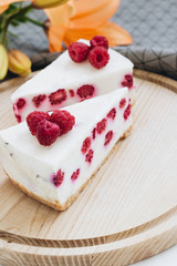 Two pieces of delicious cake with raspberries, sweet dessert