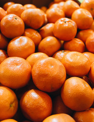Pile of fresh mandarins, food background