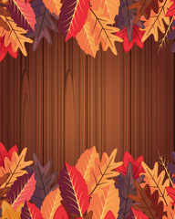 Obraz premium autumn leaves foliage on wooden background