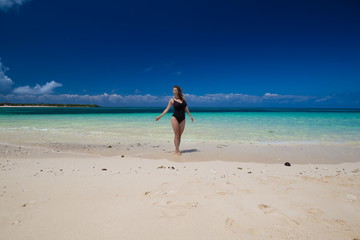 Fototapeta na wymiar Zanzibar, woman, black swimsuit, beach