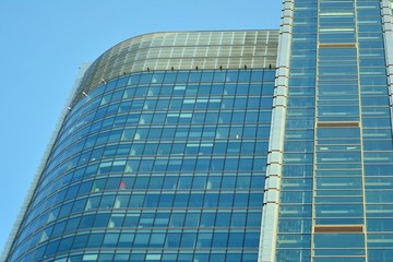 Obraz premium View of modern glass skyscraper,exterior of glass wall with abstract texture
