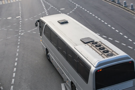 tourist bus rides on a multi-lane highway
