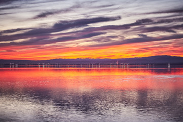 Sunset in the calm waters of the Albufera de Valencia, Spain.