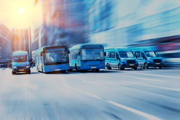 buses move along a multi-lane avenue in the city © Yuri Bizgaimer