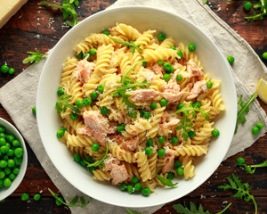 Homemade Pasta fusilli with salmon, green peas, parmesan cheese and lemon. healthy food. background.