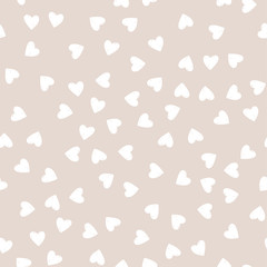 Vector seamless pattern. Simple hipster background with hand drawn white hearts.