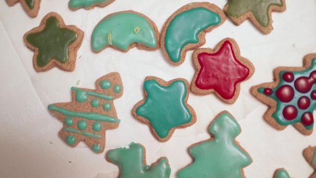 View of homebaked gingerbreads iced with colorful glaze. Christmas baking.