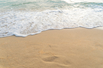 Fototapeta na wymiar softly wave on the beach sunset