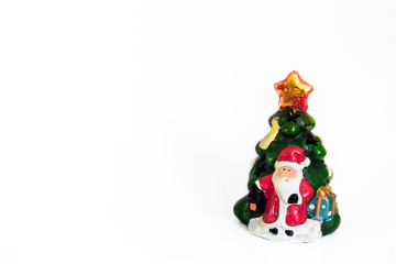 Cute toy Santa Claus isolated on white background