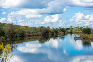 Obraz na płótnie Canvas Lake on the farm with blue sky